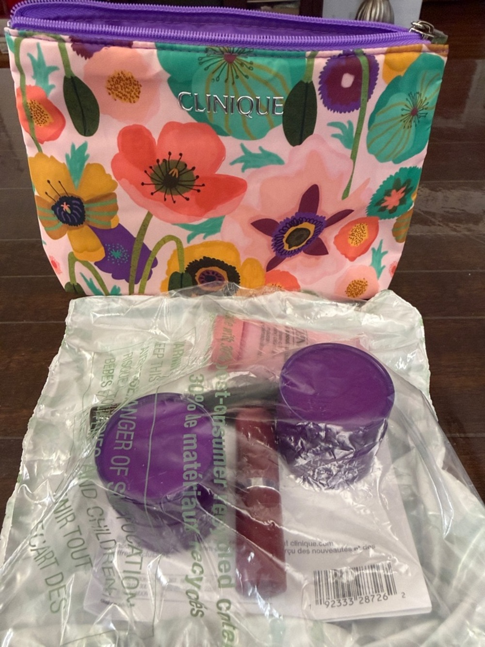 Clinique Floral Cosmetic Pouch with Sealed unopened Clinique products.